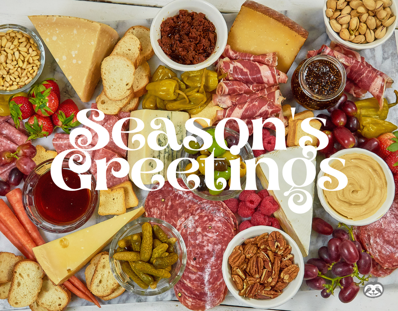 Greeting Card Cover of cured meats, cheeses, nuts, and pickles, and the words "Season's Greetings"