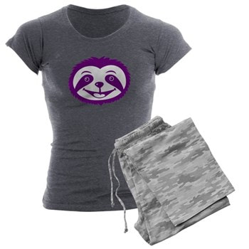 The face of Percy the Purple Sloth on gray pajamas
